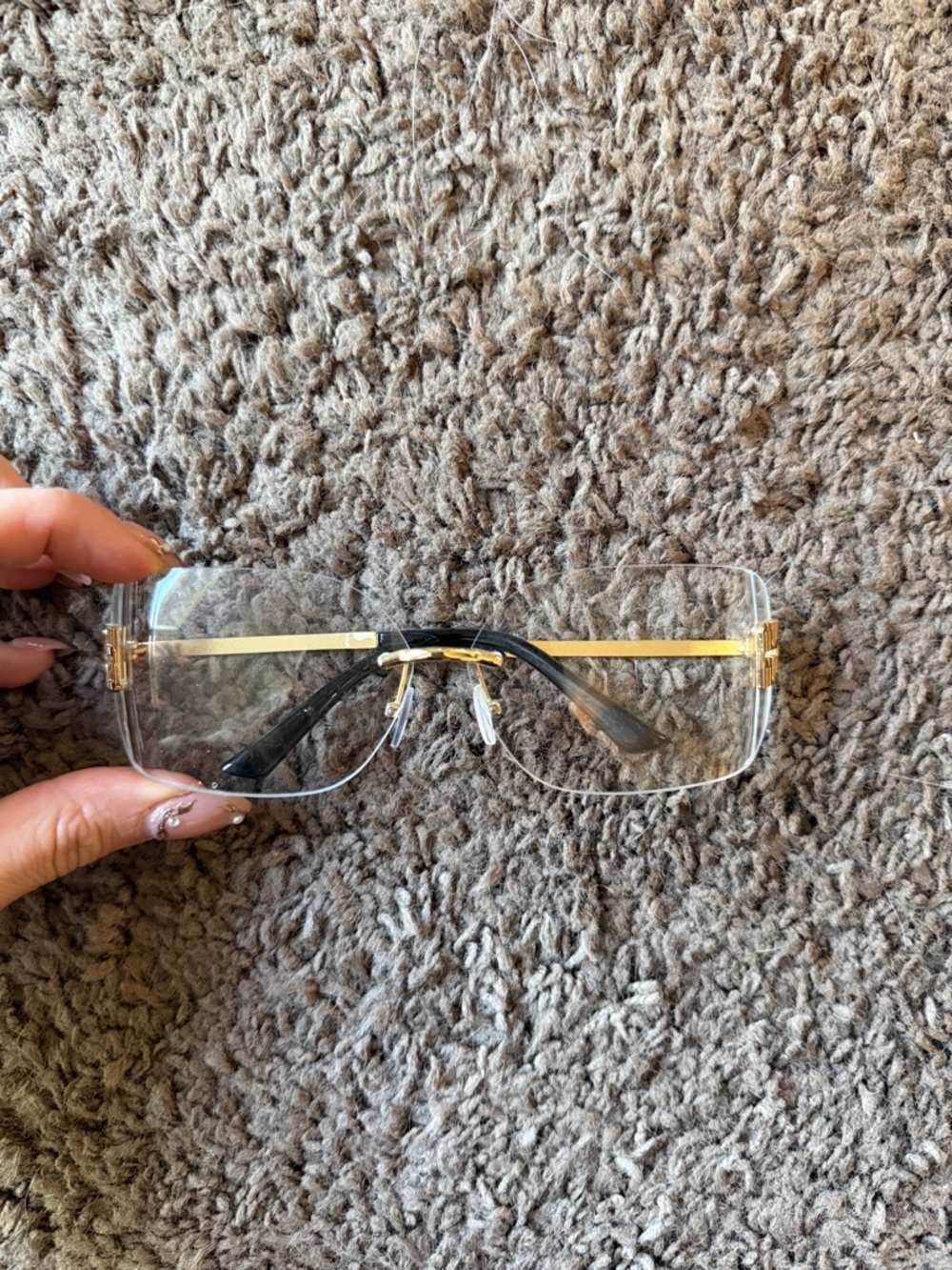 Rimless Glasses with Gold Logo Temples and Clear Lenses